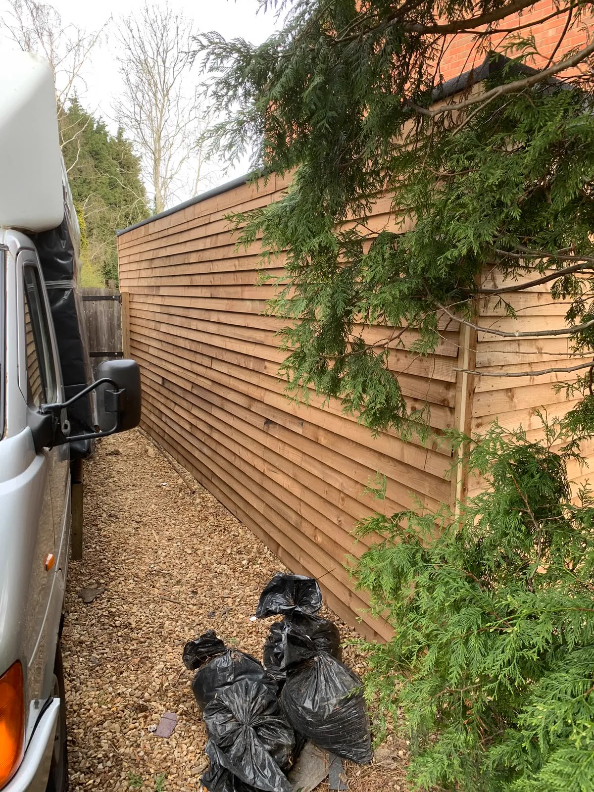 Timber cladding being installed on a custom garden room