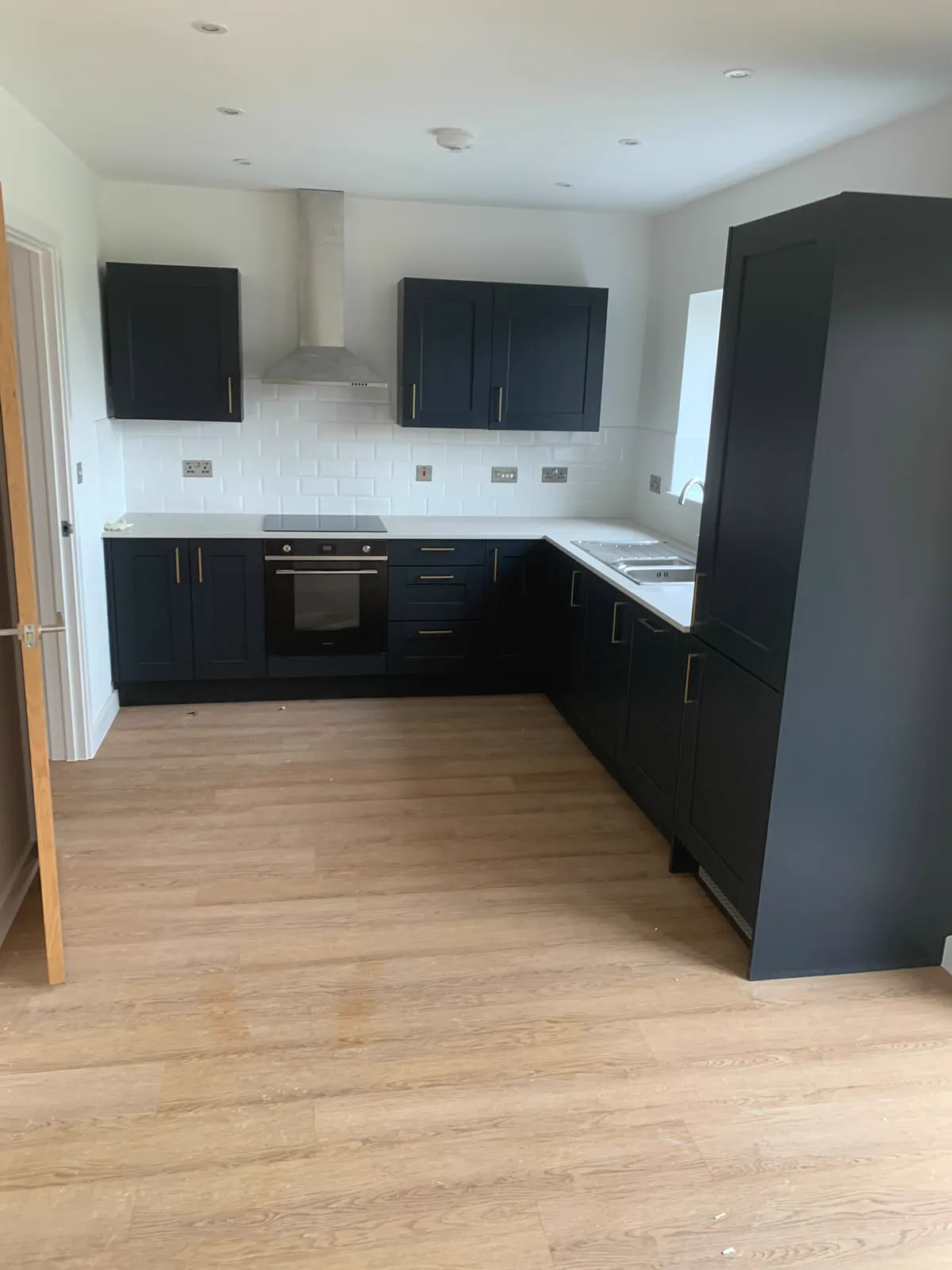 Finished navy fitted kitchen